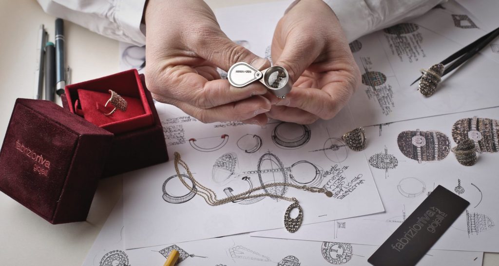 top down view of a jewelry designer inspecting a diamond